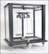 A good set of mid century ex Imperial Tobacco black glass cased scientific scales by Baird &