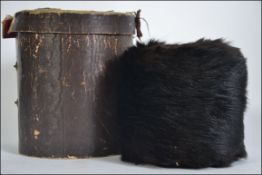 A vintage mid century ladies real fur hand muff of circular form with lined inner H13cm