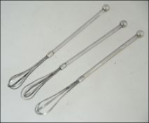 3 silver cocktail twizzle sticks, unmarked. Total weight 14.