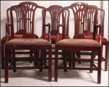 A set of 8 19th century Georgian mahogany dining chairs raised on squared supports united by