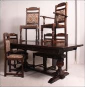 A large Jaycee solid oak refectory dining table and 6 chairs.