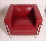 After Le Corbusier. An ' LC2 ' type red leather and chrome armchair.