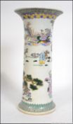 A 19th century Chinese famille rose tall cylindrical gu vase decorated with scenes of mystical