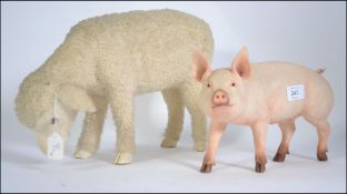 A French woollen sheep and heavy resin moulded pig , great things ,