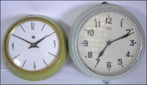 Two retro mid century Industrial office / factory electric clocks,
