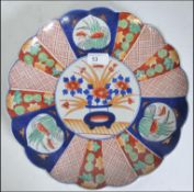 A large Imari charger with wavy rim W30cm