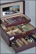 Jewellery casket full of various costume pieces to include working watches , brooches , earrings ,