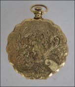 An early to mid 20th century ladies gilt hinged compact having a decorative rococo finish W6cm