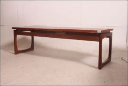 A Retro 20th century G Plan coffee - occasional table raised on shaped legs with suspension effect