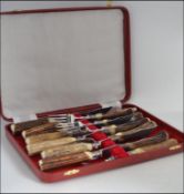 A stunning set of cased horn handled steak knives and forks by F & H limited in the original
