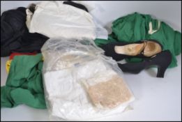 A collection of vintage and retro clothing to include a pair of unused 19th / 20th century silk