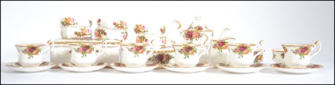 A Royal Albert Old Country Roses miniature tea service comprising cups, saucers, plates,