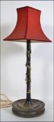 A stunning early to mid 20th century clarinet having a later conversion into a table lamp,