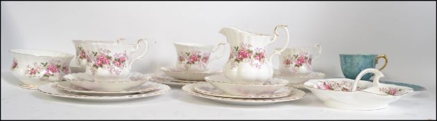 A Royal Albert China tea service in the Lavender pattern consisting of cups, saucers, side plates,