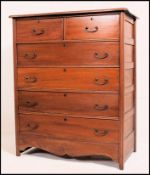 A continental 20th century large walnut chest of drawers,