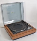 A retro three speed Garrard 86 SB MkII record deck having a wooden case with a smoked perspex lid
