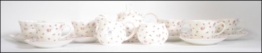 A good mid century retro ceramic tea service by Queens China to include teapot, cups, saucers,