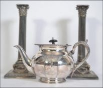A pair of good quality silver plated rococo column candle sticks by Elkington along with a silver