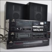 A retro JVC music stacking system, consisting of a tuner, amp,