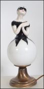 A stunning chintzy vintage French over painted glass table lamp in the form of a female pierrot