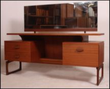 A 1970's retro dressing table in the manner of Mogens Kolo having low wide body with a series of