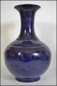 A large Chinese blue and white gilt decorated vase of bulbous form with waisted neck.
