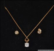 A 9ct gold and diamond necklace pendant earrings set.