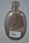 A silver hallmarked hip flask of lozenge form being hallmarked for London 1909, weight 120.