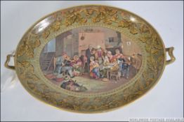 A Pratt ware dish circa 1860 printed with ' The Blind Fiddler ' pattern after Sir David Wilkie.