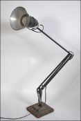 A vintage mid 20th century two step anglepoise desk lamp with all over blackened finish stamped