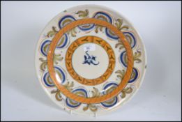 An 18th century Delft polychrome charger,