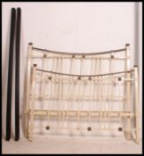 A Victorian restored double bed frame in cast metal and brass in the Art Nouveau style complete