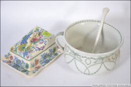 A 20th century mason's cheese dish along with a Royal Doulton chamber pot. Measures: 17cms wide.