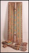 A collection of Indian painted embellishments of wooden construction to include base,