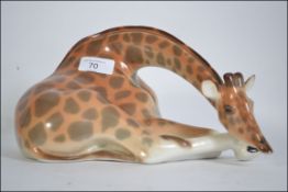 A USSR Losomanov ceramic model of a large recumbent giraffe,
