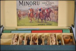 A vintage boxed The New Race Game Minoru appears to be complete with instructions