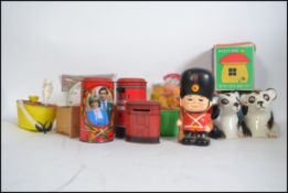 A good collection of vintage and retro money boxes to include tin, wooden,