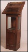 An Edwardian 20th century eclesiastical lecturn - reading stand with glass centre display cabinet