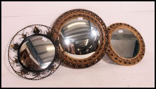2 vintage gilt framed 20th century convex mirrors together with a metal framed rococo type convex