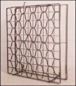 A mid century wrought metal Industrial bottle rack ideal as a conversion to a square coffee table (