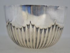 A solid silver heavy ribbed hallmarked silver bowl. Marks rubbed to underside (unreadable).