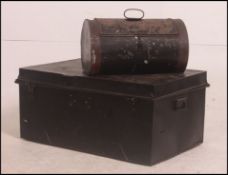 A vintage ebonised tin steamer trunk along with another tin trunk of unusual form please see images.