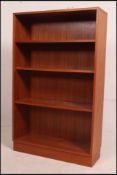 A 1970's G-Plan large open window bookcase of Danish influence having plinth base with open window