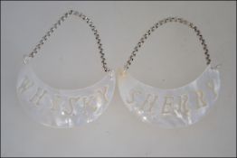 A pair of mother of pearl decanter labels for whisky and sherry W7cm
