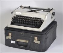 A vintage mid century portable Erica typewriter,