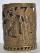 A Chinese double skin cast bronze brush pot Worked with figures mountain river landscape,