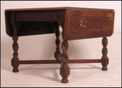 A 1930's oak barley twist refectory square draw leaf dining table - pub table.