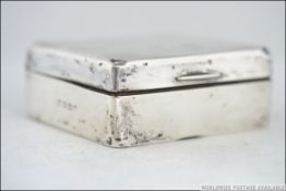 A silver hallmarked table top cigarette case by William Neale & Sons Ltd,
