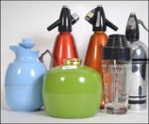 A collection of bar related items to include soda syphons,