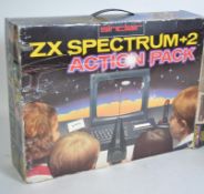 VINTAGE GAMING: A collection of vintage games and consoles to include a boxed ZX Spectrum +2 Action